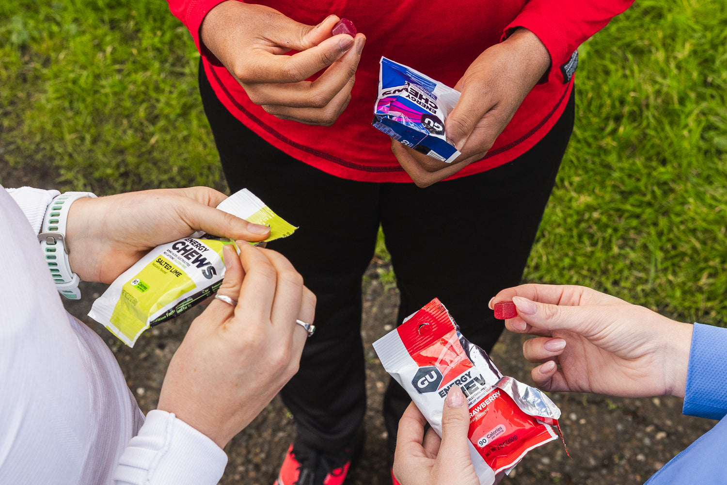 3 people holding energy chews