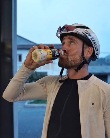 Athlete drinking milk at store