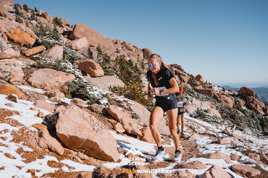 Anna Gibson running up a mountain.