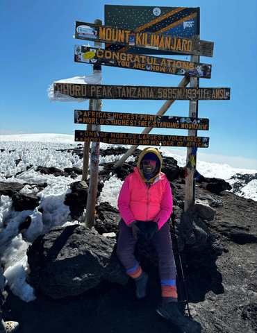 Alison on the top of Mt Kilimanjaro